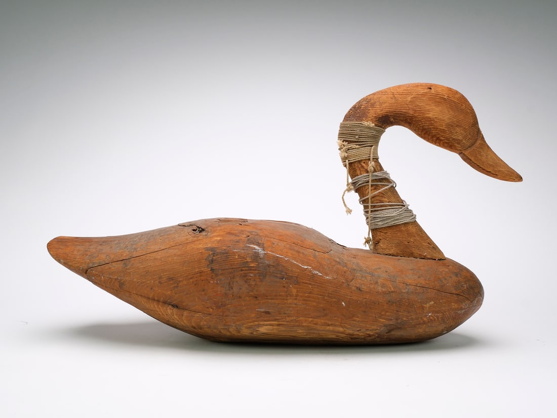 Unknown maker, 20th century.: Unpainted swan with body very similar to the work of John Williams. Mackey collection ink stamp on the underside. Measures 29" long. Provenance: Al Marzorini collection.