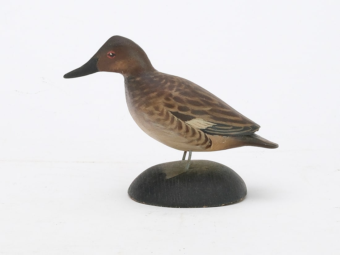 A. Elmer Crowell (1862-1952), East Harwich, Massachusetts.: Miniature canvasback hen. Maker's rectangle stamp and signature on the underside. Measures 4.5" long.