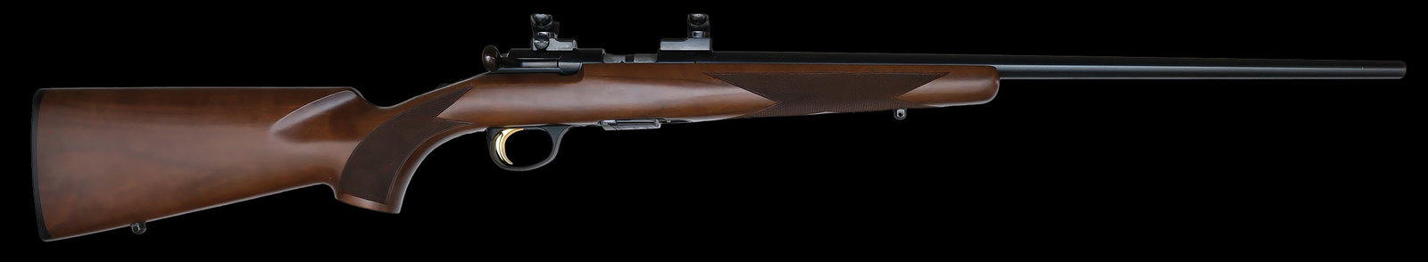 NEAR MINT BROWNING T-BOLT RIFLE WITH BOX AND SCOPE.: SN. 0199MN253. Cal. .17 HMR. Built with 22" blued round brl. Blued action. Walnut stock is checkered in point and diamond pattern and has sling eyes. Scope rings mounted and comes with a Tasco 4x
