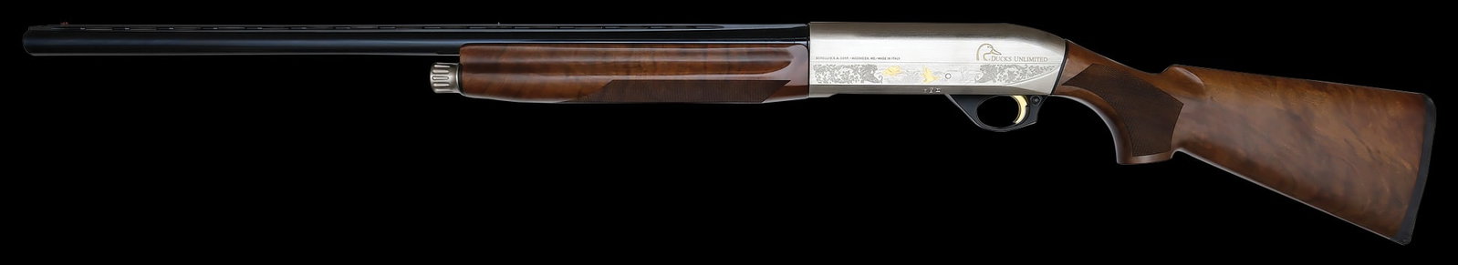 AS NEW BENELLI MONTE FELTRO ENGRAVED DUCKS UNLIMITED 12 GAUGE SHOTGUN WITH CASE.: SN. 2014DU1488L. Cal. 12ga. Built with 28" brl that has ventilated top rib. Walnut forend with finger grooves on sides and is checkered with maker's name on right side. Anodized action is nicely scrol