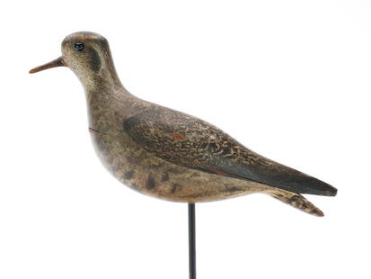 Unknown maker, 19th century, Cape Cod, Massachusetts.: Excellent golden plover in winter plumage. Thinly hollowed two piece body and outstanding paint detail. Measures 11&#8221; long. Provenance: Ted and Judy Harmon collection.