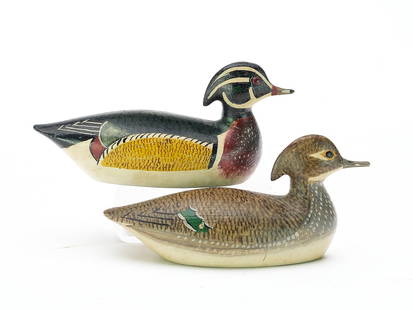 George Boyd (1873-1941), Seabrook, New Hampshire.: Outstanding pair of miniature wood ducks. Extended crest carving and very detailed paint pattern. Both identified in pencil on underside. Measure 3.75" long. Provenance: Dan Graf collection.&#160; Lit
