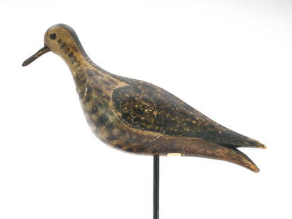 Joseph Lincoln (1859-1938), Accord, Massachusetts.: Golden plover in emerging&#160;plumeage with split tail carving and tack eyes. Measures 10" long. Provenance: Tom Karras collection.