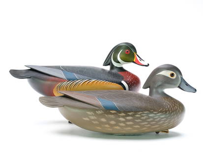 George Strunk (b.1958), Glendora, New Jersey.: Pair of wood ducks with slightly turned heads and extended crests. Raised wingtip and relief tail feather carving. "G Strunk" stamped in lead weights. Measure 13.5" long.