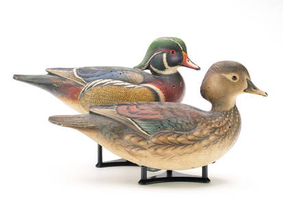 Leo McIntosh (1953-2007), Adams, New York.: Excellent rigmate pair of wood ducks. Hollow carved with slightly turned heads and extended crests. Drake with tucked head, hen with slightly raised head. Both with relief wingtip and tail feather car
