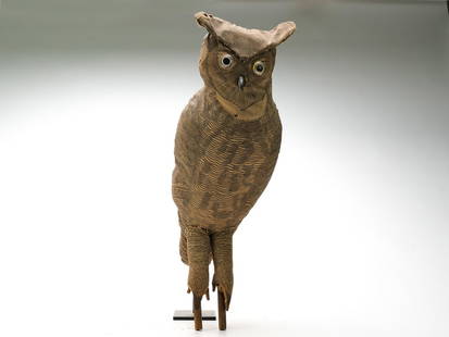Herters Decoy Factory, Waseca, Minnesota.: Rare cloth owl with bear claw bill and large glass eyes. Lithographed canvas is stuffed with straw. With wooden dowles inserted in to legs. Measures 20" long.