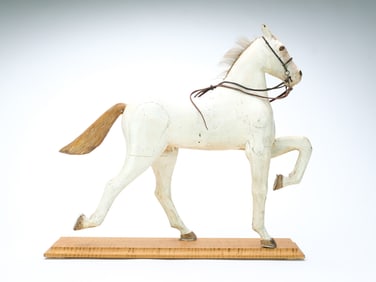 Carved prancing horse.
