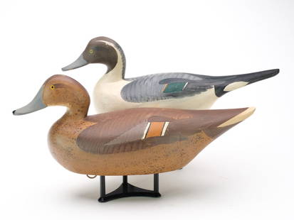 Madison Mitchell (1901-2003), Havre de Grace, Maryland.: Pair of flat bottom pintails. Hen with slightly turned head. Drake is unsigned. Hen is signed and dated 1977 in electropen on one side. Measure 18" and 17.25" long. Provenance: Purchased from the make