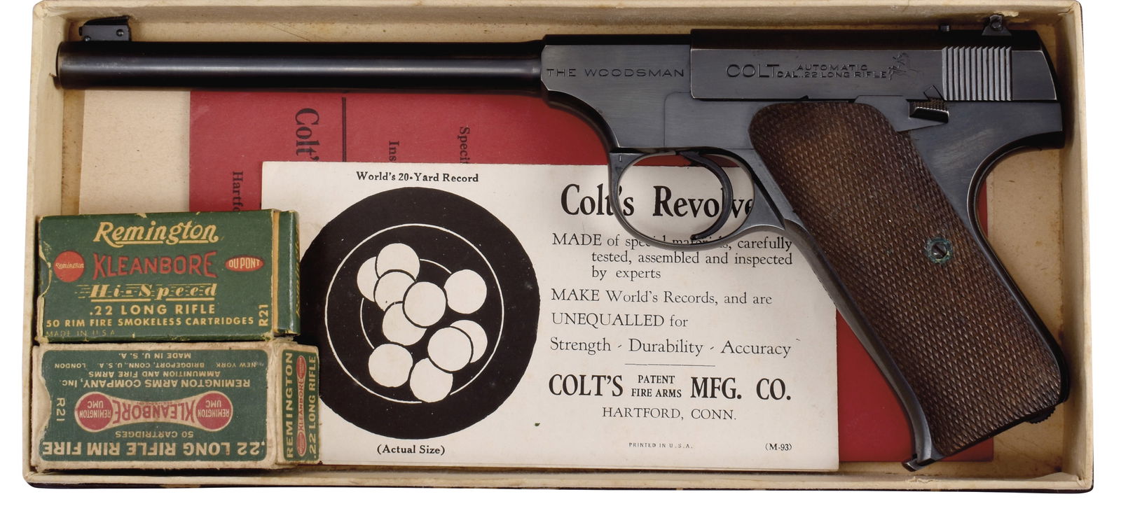 AS NEW COLT WOODSMAN TARGET MODEL WITH ORIGINAL BOX.: SN. 74239. Cal. .22LR. Built with 6-1/2" blued brl. Full checkered walnut grips. Gun is housed in its factory original numbers matching box with original paperwork and hang tag. Box with two "Remingto