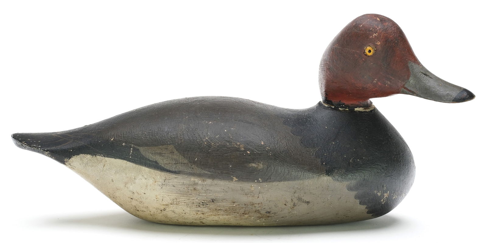 Mason Decoy Factory (1889-1924), Detroit, Michigan.: Early redhead with slightly turned head. Challenge grade model with nice swirl paint at breast. Two inlaid lead weights on underside. Goodman collection sticker on underside. Measures 14" long.