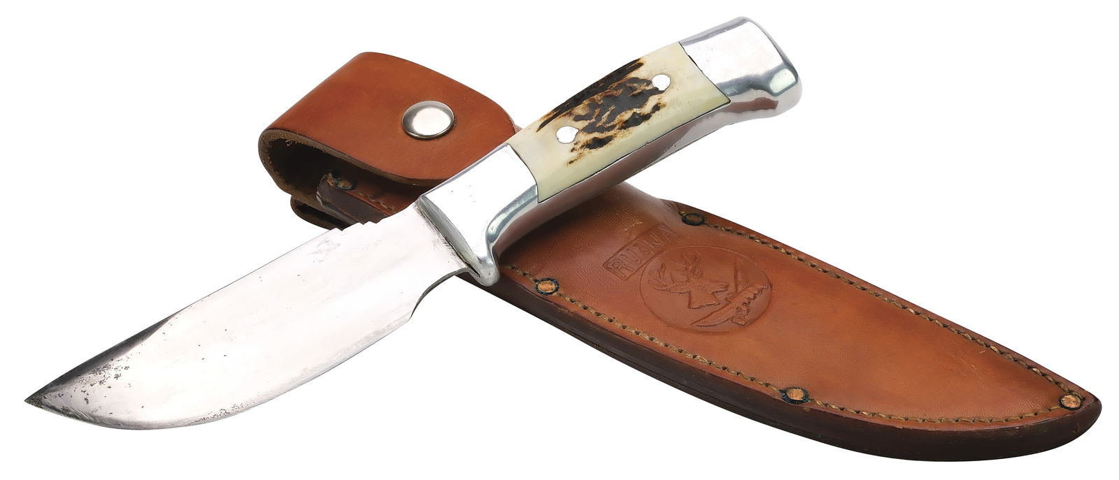 Ruana skinning knife.: With bone handle. Blade measures 4.75". Handle measures 4.25". Includes stamped sheath. 