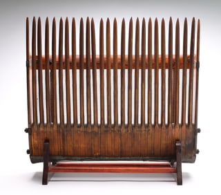 Vintage cranberry scoop, circa 1900.