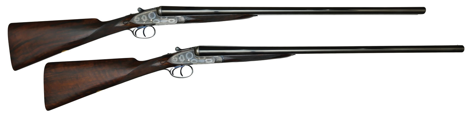 EXCEPTIONAL BOSS & CO. SELF OPENING TRUE PAIR OF 12 BORE GAME GUNS WITH ORIGINAL CASE.: SN. 8311 & 8312. Cal. 12ga. Built with 28" chopperlump fluid steel brls that have concave top rib with small brass front bead. Rib engraved "BOSS & CO. 41 ALBEMARLE STREET, PICCADILLY, LONDO