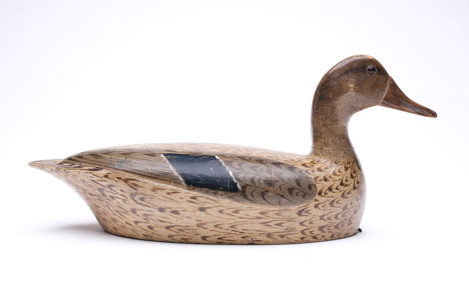 Charles Walker (1873-1954), Princeton, Illinois.: Extremely rare mallard hen from the Jolley rig. Hollow carved with relief wing carving. One of only two Jolley rig hens with raised wing carving. "Jolley" carved in underside. Measures 17.25" long. Pr