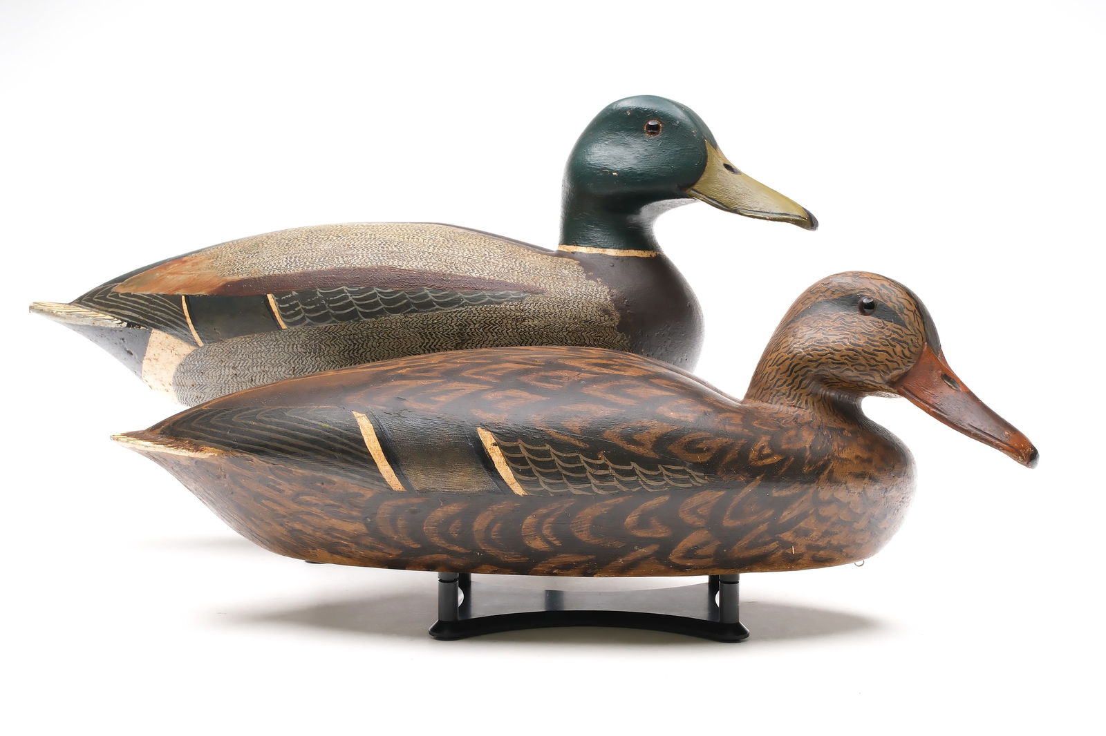 Hector "Heck" Whittington (1907-1981), Oglesby, Illinois.: Pair of mallards. Part of a rig modeled after Shang Wheeler. Each of which was named. Drake signed and dated 1947 with the name James painted on underside. Hen signed and dated 1946 with the name Mary
