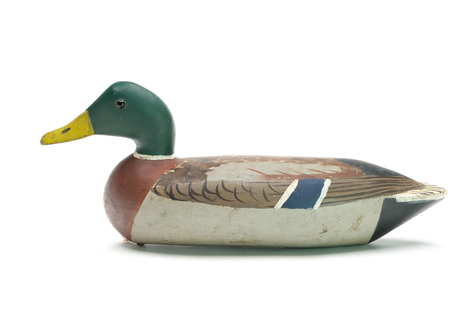 Walter "Tube" Dawson (1882 - 1955), Putnam, Illinois.: Mallard. Hollow carved with comb feather paint detail on back. Measures 17" long. Provenance: Jim and Diane Cook collection.