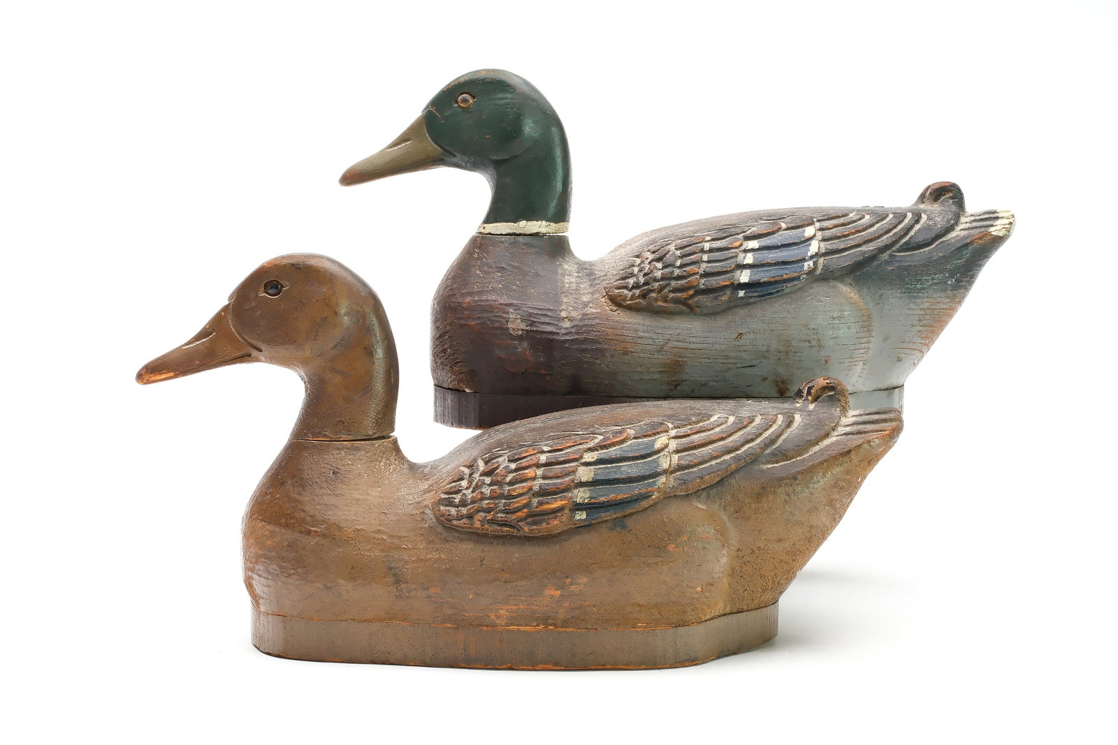 Herters Decoy Factory, Waseca, Minnesota.: Rigmate pair of mallards. Model perfect with relief wing carving. "GBM" and "Mackey" branded on underside. Also with the McCleery collection ink stamp on underside. Measure 14" long. Provenance: Dr. J