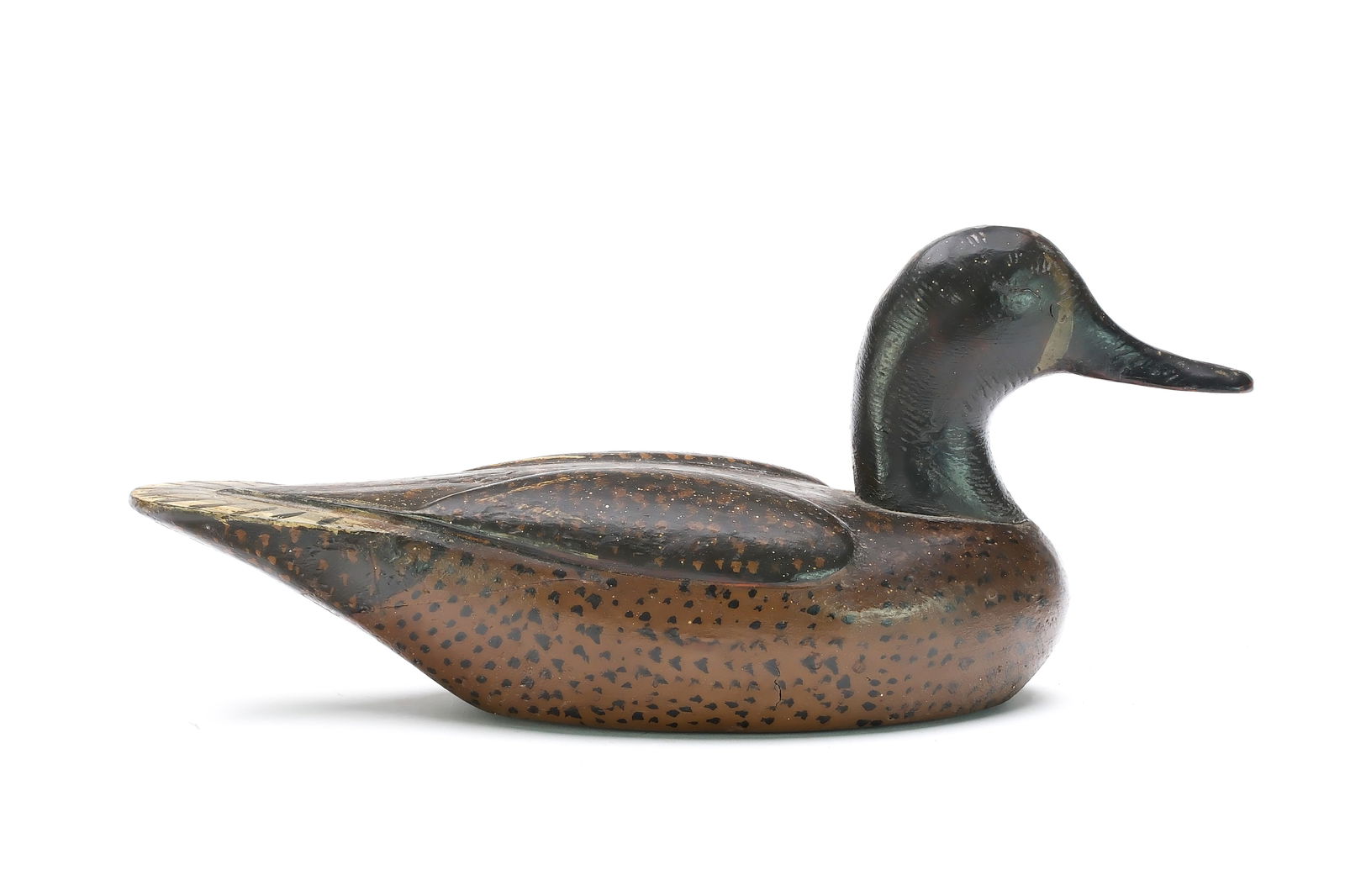 Duncan Ducharme (1912 - 1972), Delta Marsh, Manitoba.: Very rare bluewing teal with relief wing carving. Maker's ink stamp on underside. Never rigged or weighted. Measures 12.75" long. Provenance: Jim and Diane Cook collection.