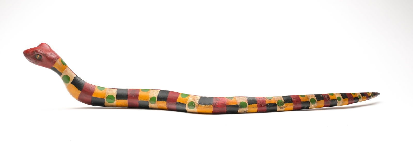 Frank Finney (b.1947), Cape Charles, Virginia.: Wonderful folk carved snake. Colorful folky paint pattern. Maker's initials carved in underside. Measures 30" long.
