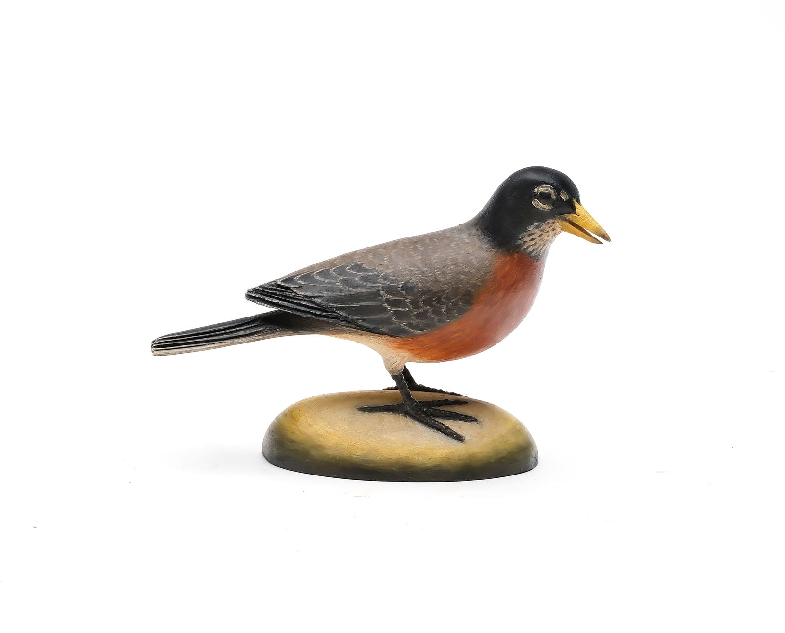 Frank Finney (b.1947), Cape Charles, Virginia.: Half size robin. Slightly turned head and open beak. Relief wingtip and tail feather carving. Identified on underside and with makers initials carved in underside. Measures 6.5" long.