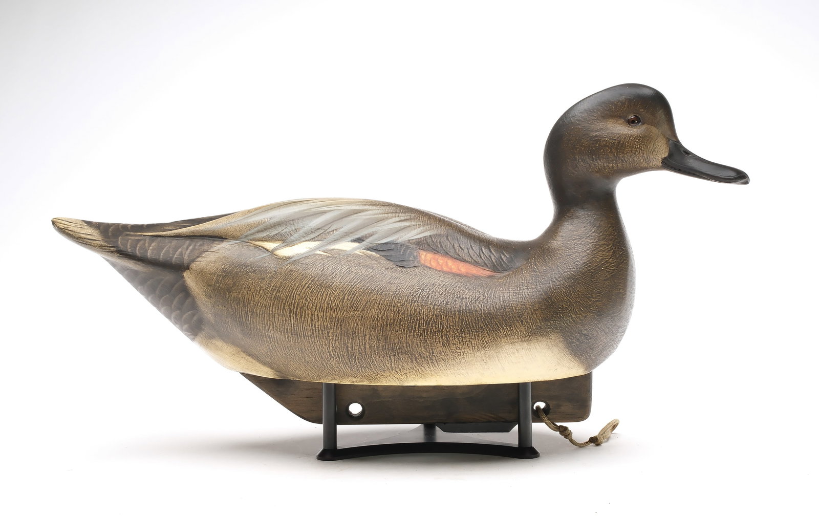 Jim Schmiedlin (1945-2015), Bradfordwoods, Pennsylvania.: Gadwal. Hollow carved with relief wing carving. "JAS" brand and maker's reward for return label on underside. Dated 2012. Measures 18.75" long.