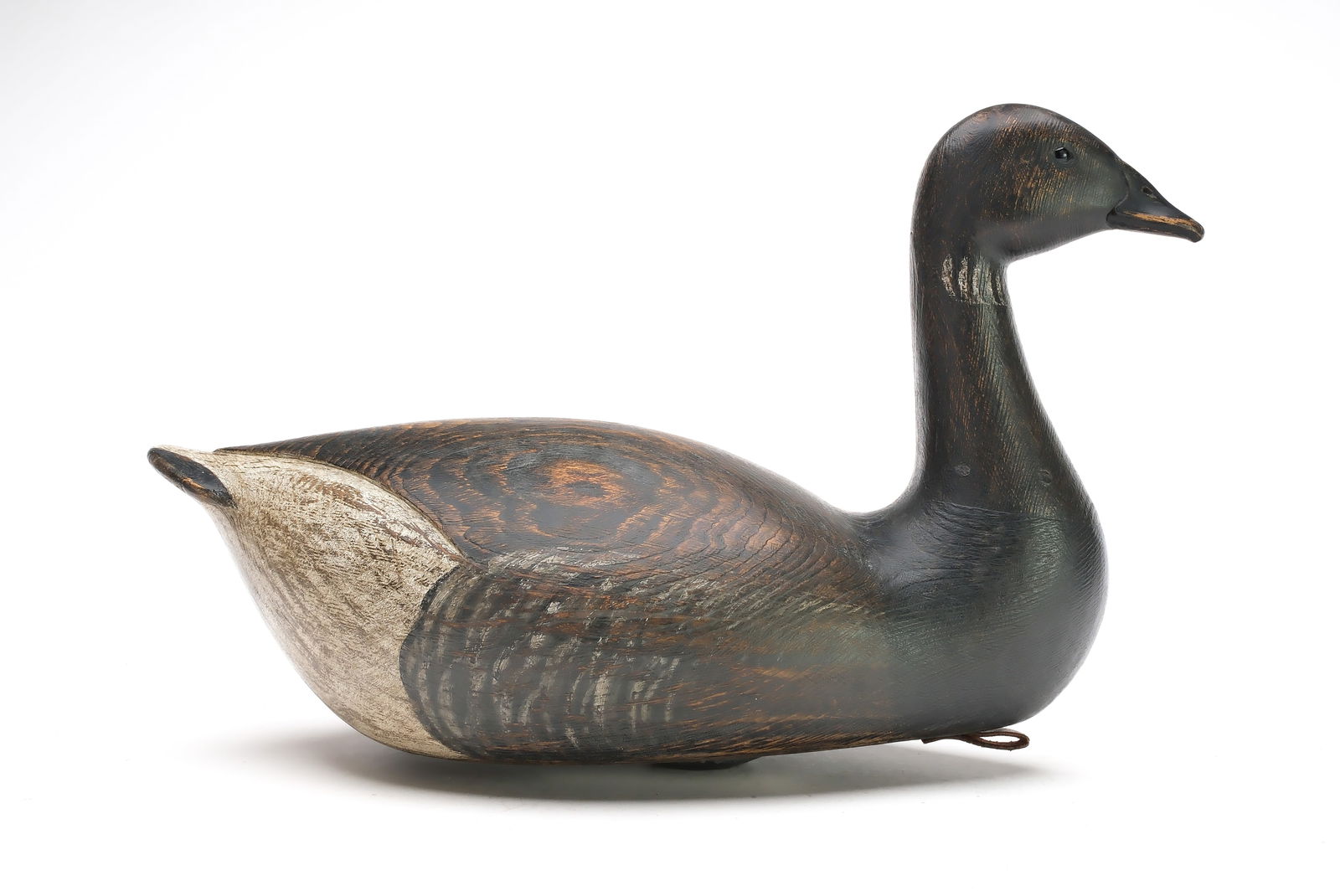 Marty Hanson (b. 1965), Hayward, Wisconsin.: Sculptural brant. Hollow carved with relief wingtip carving. Applied hardwood bill is splined through back fo head. "MH" carved in underside. Measures 17" long.