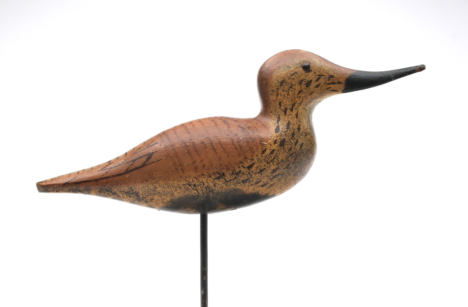 Dodge Decoy Factory (1883-1893), Detroit, Michigan.: Near mint dunlin. One piece body, head, and bill. With metal tack eyes. Excellent paint detail. "XXIX" stamped in underside. Measures 12" long. Provenance: William J. Mackey Jr collection. Mackey Fami