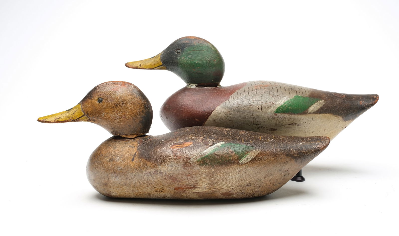 Dodge Decoy Factory (1883-1893), Detroit, Michigan.: Rigmate pair of mallards. Tack eyes and slightly turned heads. 75 stamped in hen, 76 in drake. Measure 15.5" long. Provenance: Len Carnaghi collection.
