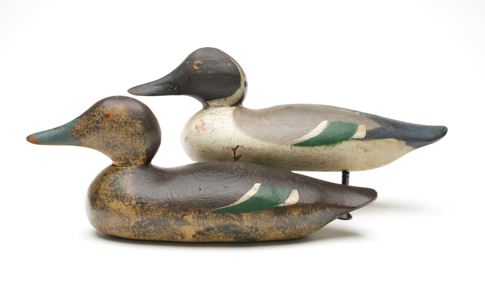 Mason Decoy Factory (1889-1924), Detroit, Michigan.: Pair of pintails. Painted eye model. "K" branded on underside of hen. Also with "WE Beck" painted on underside. Measure 15.5" long. Provenance: Chris Mackey collection.