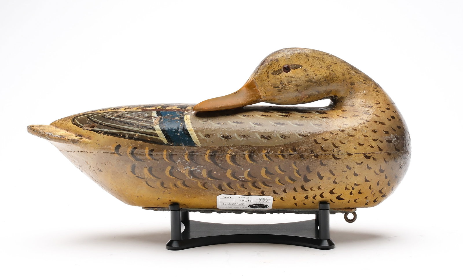 Charles Perdew (1874-1963), Henry, Illinois.: Preening mallard hen. Hollow carved. Retains the original Perdew weight. Measures 14" long. Provenance: Martin and Deborah Maloy collection.