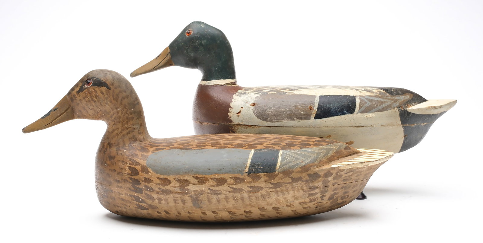 Roy Hancock, Bath, Illinois.: Rigmate pair of mallards. Hollow carved. "MS" stamped in undersides. Measure 17.5" long. Provenance: Dr. Michael Shannahan collection.