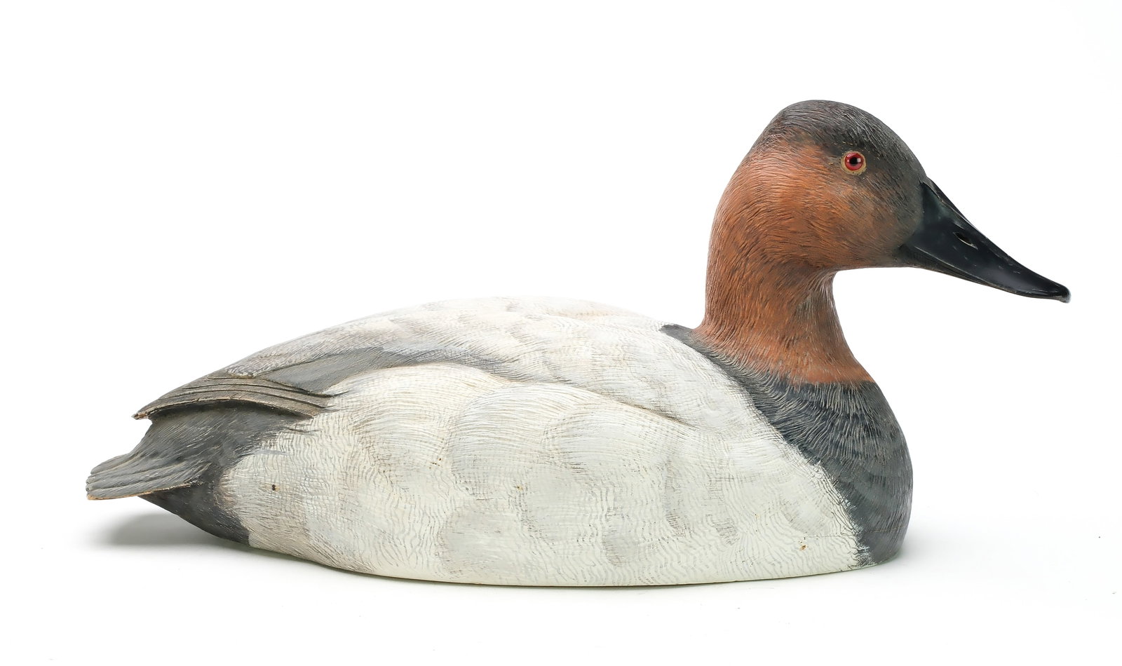 Jim Foote (1925-2004), Gibraltar, Michigan.: Hollow carved canvasback with detailed feather carving and slightly turned head. Signed and dated 1974. Measures 16" long. Provenance: Len Carnaghi collection.