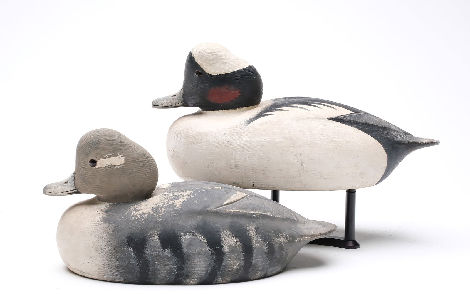 Ken Anger (1905-1961), Dunnville, Ontario.: Pair of buffleheads with relief wing carving and feather rasping. Measures 10" and 11" long. Provenance: Deborah and Martin Maloy collection.