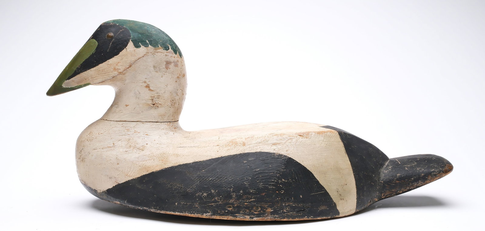 Charles F. Jacobs, Grand Manan Island, New Brunswick.: Oversized eider with brass tack eyes. "C.F. Jacobs" branded on underside. Measures 22" long. Provenance: Deborah and Martin Maloy collection.