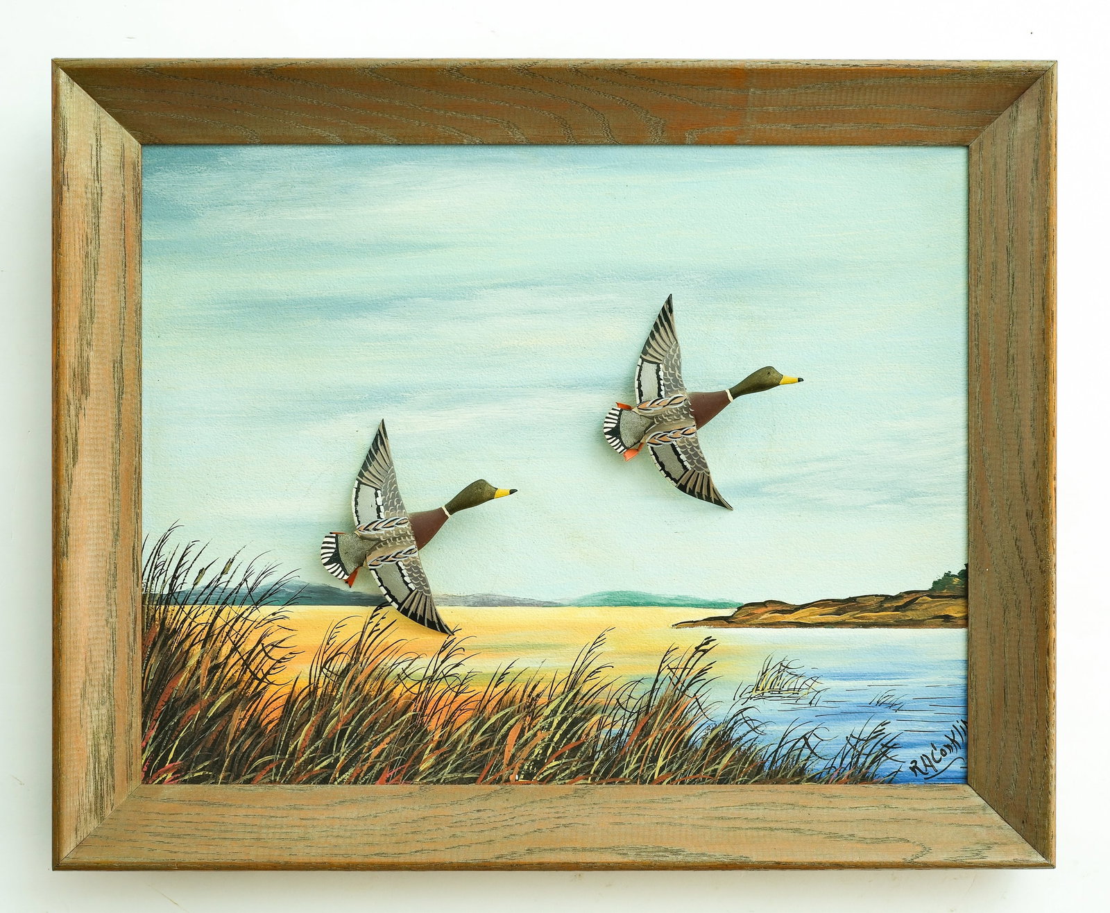 Roy Conklin (1909-1967), Alexandria Bay, New York.: Flying miniature mallard diorama. Two mallard drakes applied to painted backboard, that is signed lower right. Ducks measures 4.25" long. Frame measures 16.5" x 20.75". Provenance: Dean Hyde col