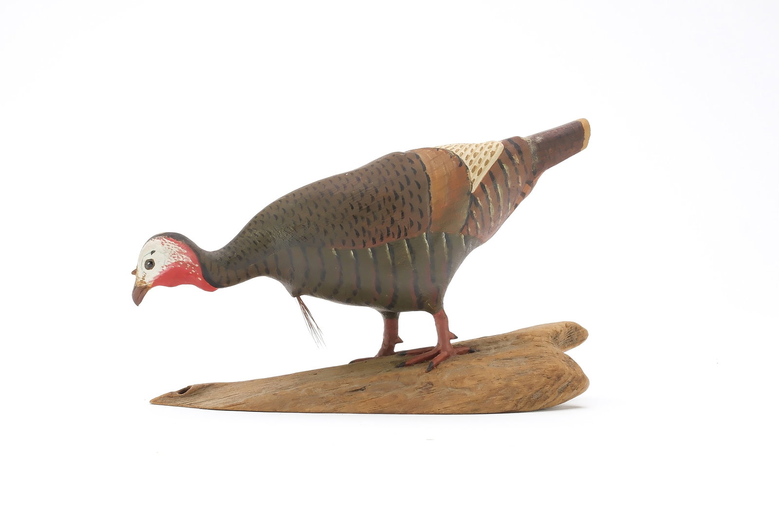 Harold Gibbs (1886-1970), Barrington, Rhode Island.: Miniature feeding turkey. Initialed on underside. Measures 6" long. Provenance: Joseph Ellis collection. Literature: "Birds in Wood and Paint" by Joseph H. Ellis, page 119, exact carving pictured