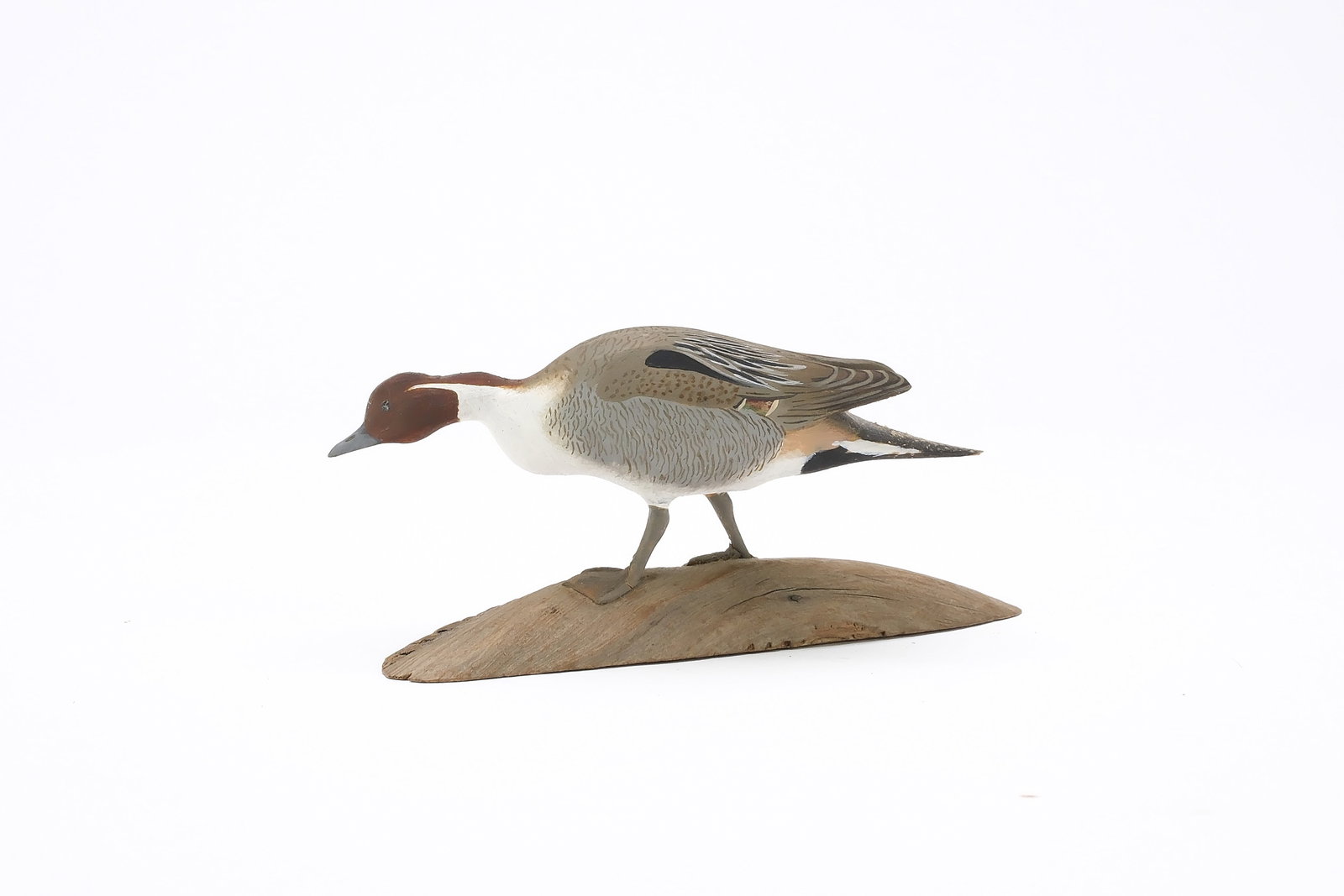 Harold Gibbs (1886-1970), Barrington, Rhode Island.: Miniature walking pintail. Extended wingtips. Signed and dated 1947. Measures 4.25" long. Provenance: Joseph Ellis collection. Literature: "Birds in Wood and Paint" by Joseph H. Ellis, page 118, exact