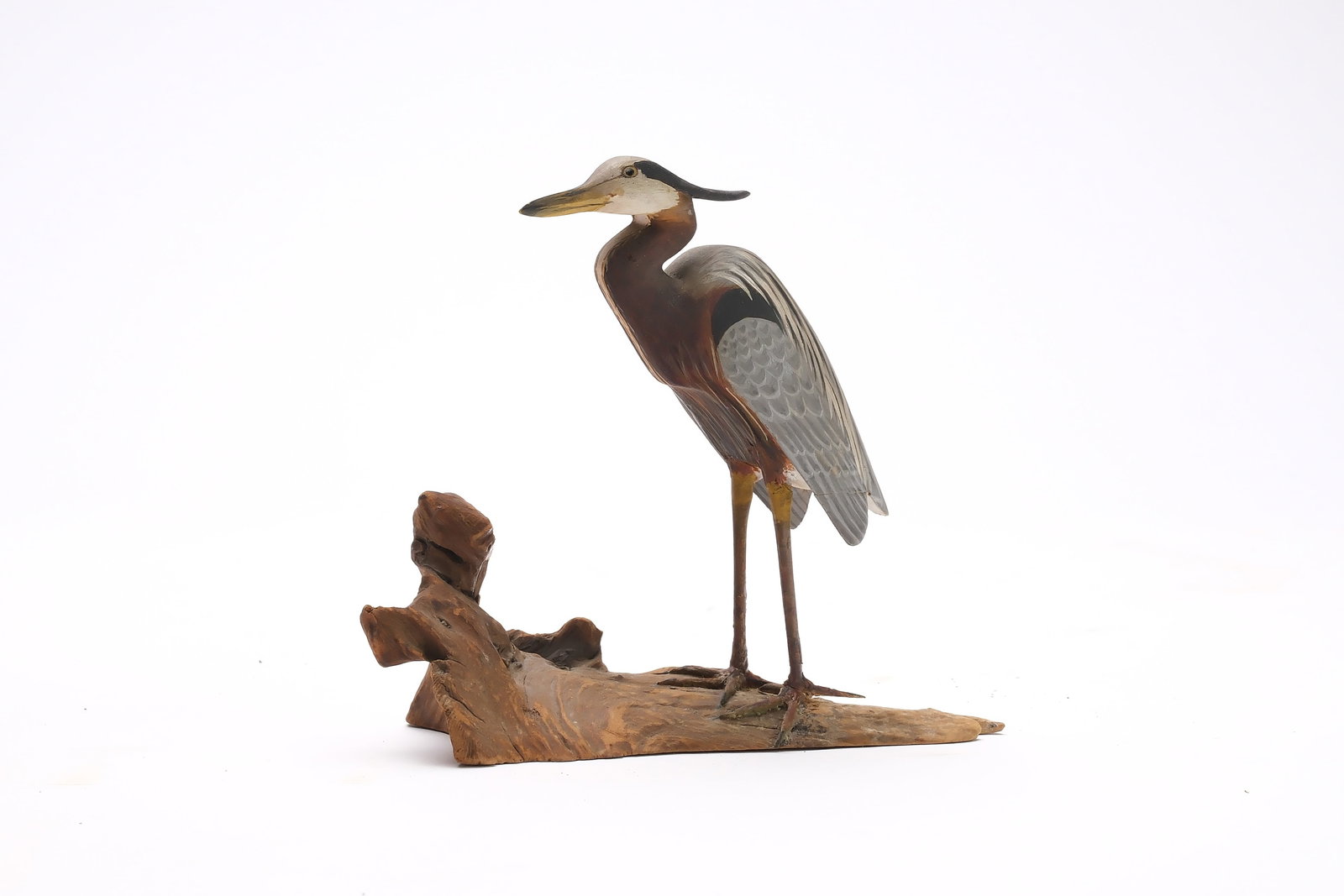 Harold Gibbs (1886-1970), Barrington, Rhode Island.: Miniature great blue heron with dropped wingtips and extended crest. Identified, initialed, and dated 1939. Measures 4" long. Provenance: Joseph Ellis collection.