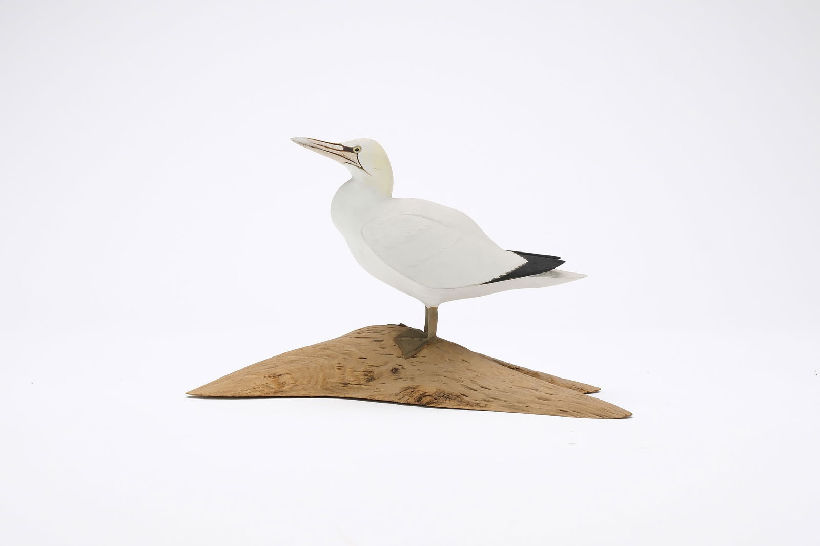 Harold Gibbs (1886-1970), Barrington, Rhode Island.: Miniature gannet. Deep relief wing carving and raised wingtips. Identified, initialed, and dated 1945. Measures 5" long. Provenance: Joseph Ellis collection.