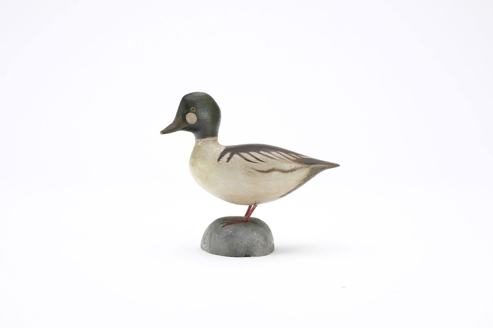 Jess Blackstone (1909-1988), Concord, New Hampshire.: Miniature goldeneye. Smooth body with slightly turned head. Identified, initialed, and numbered 1 on underside. Also dated 1942. Measures 4" long. Provenance: Joseph Ellis collection.