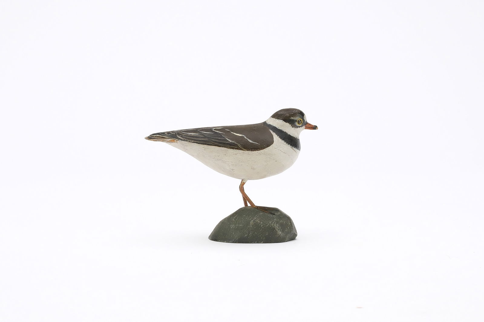 Jess Blackstone (1909-1988), Concord, New Hampshire.: Miniature semi palmated plover. Feather rasping and slight relief wingtip carving. Identified, initialed, and numbered 1 on underside. Also dated 1947. Measures 3.25" long. Provenance: Joseph Ell