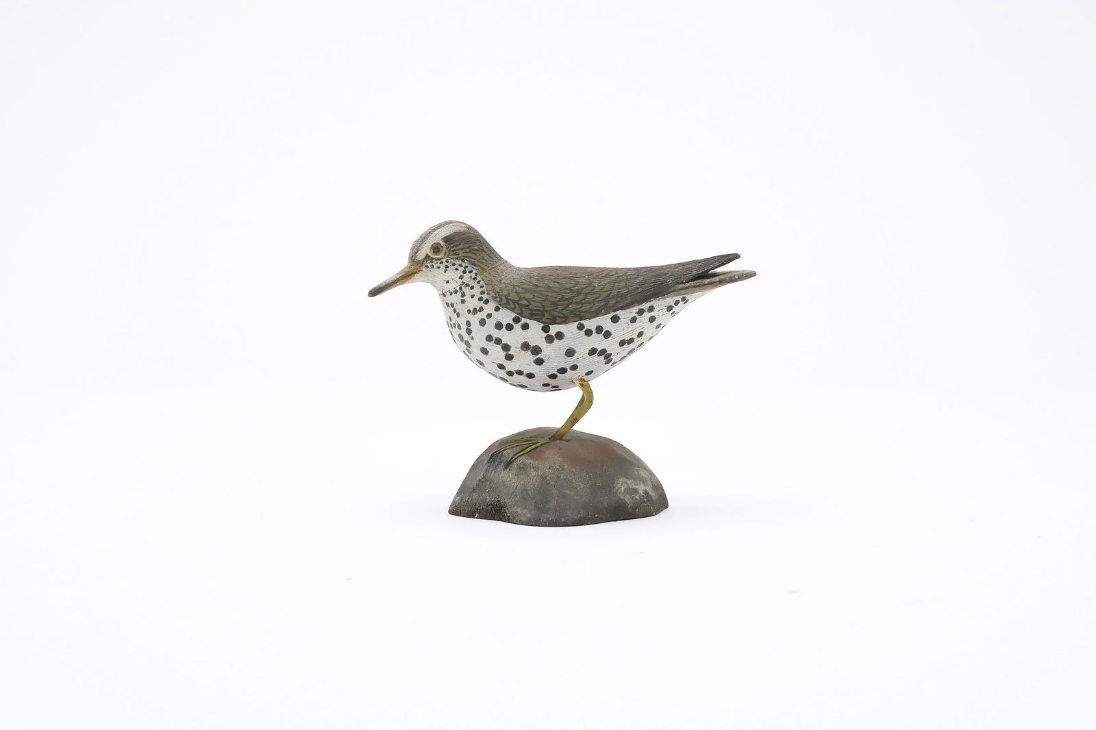 Jess Blackstone (1909-1988), Concord, New Hampshire.: Miniature sandpiper. Raised wingtips and feather rasping. Head is turned slightly to one side. Identified, initialed, and numbered 6555 on underside. Measures 3.5" long. Provenance: Joseph Ellis