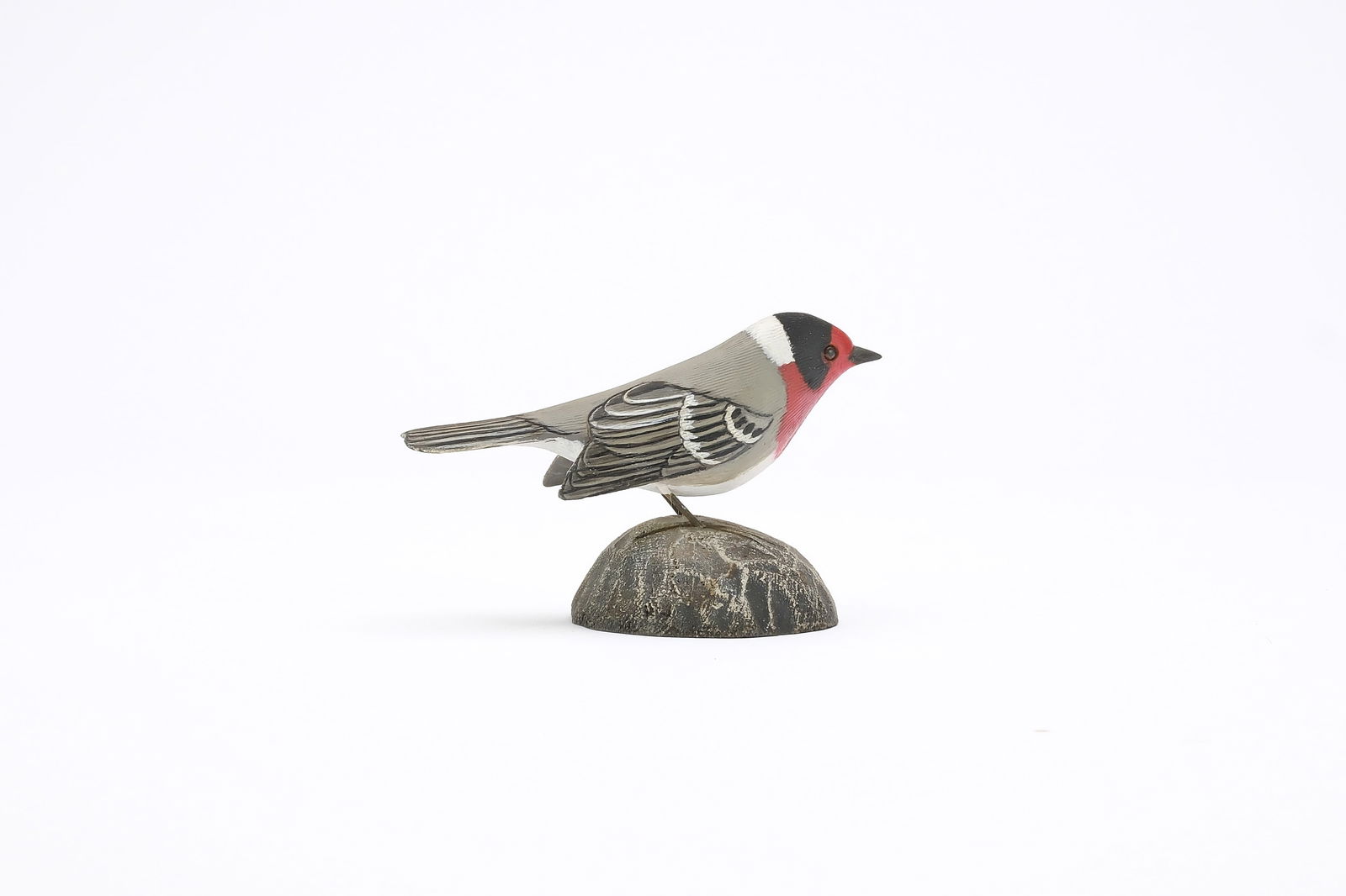 Jess Blackstone (1909-1988), Concord, New Hampshire.: Miniature red faced warbler. Dropped wing carving and feather rasping. Identified, initialed, and numbered 1 on underside. Measures 3.5" long. Provenance: Joseph Ellis collection.