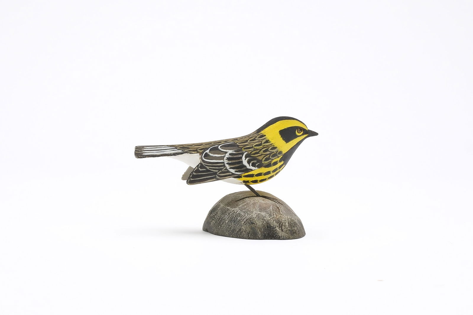 Jess Blackstone (1909-1988), Concord, New Hampshire.: Miniature townsend's warbler. Dropped wing carving and feather rasping. Identified, initialed, and numbered 1 on underside. Measures 3.5" long. Provenance: Joseph Ellis collection.