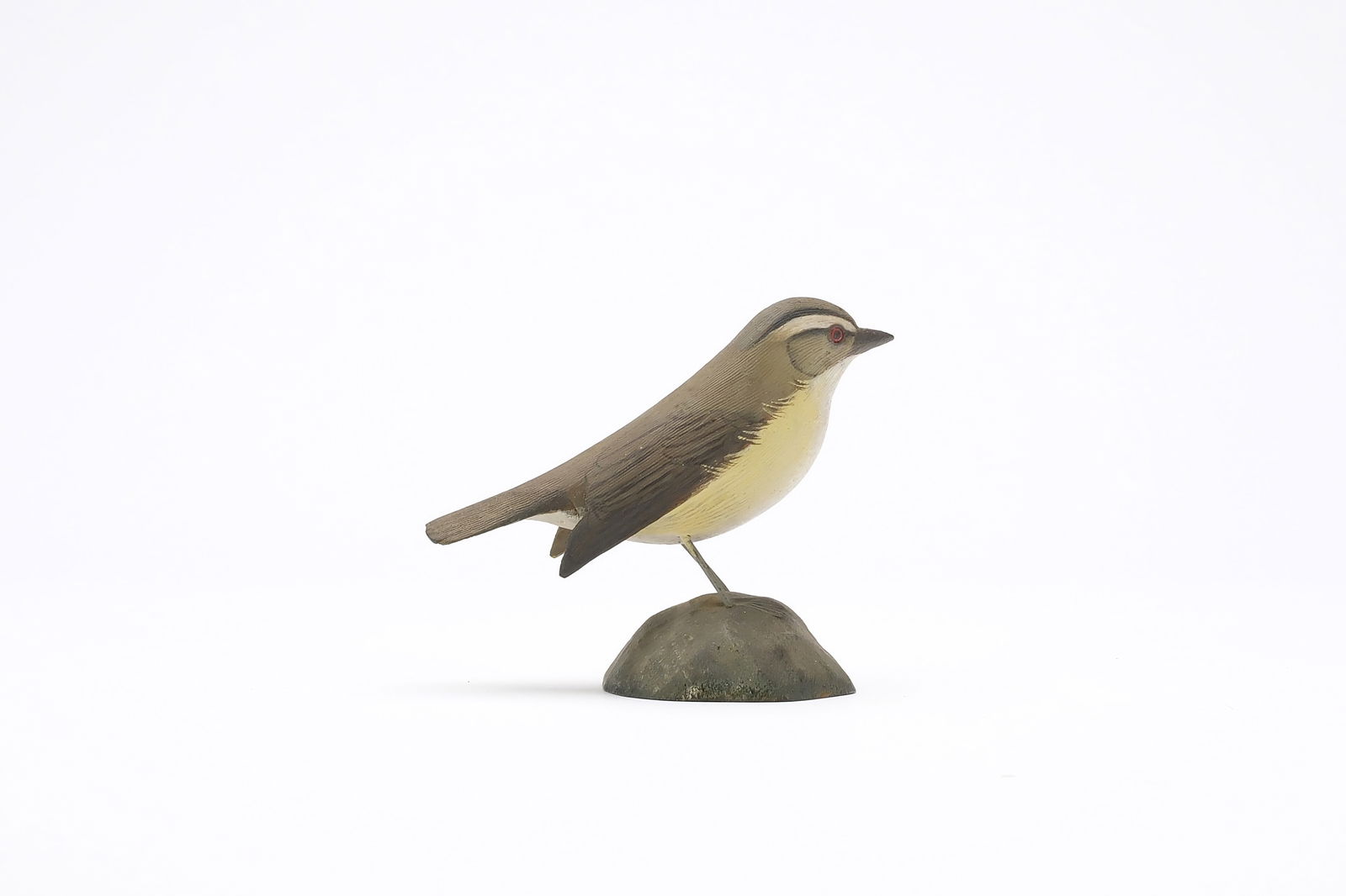 Jess Blackstone (1909-1988), Concord, New Hampshire.: Miniature red eyed vireo. Dropped wing carving and feather rasping. Identified, initialed, and numbered 2 on underside. Measures 3.75" long. Provenance: Joseph Ellis collection.