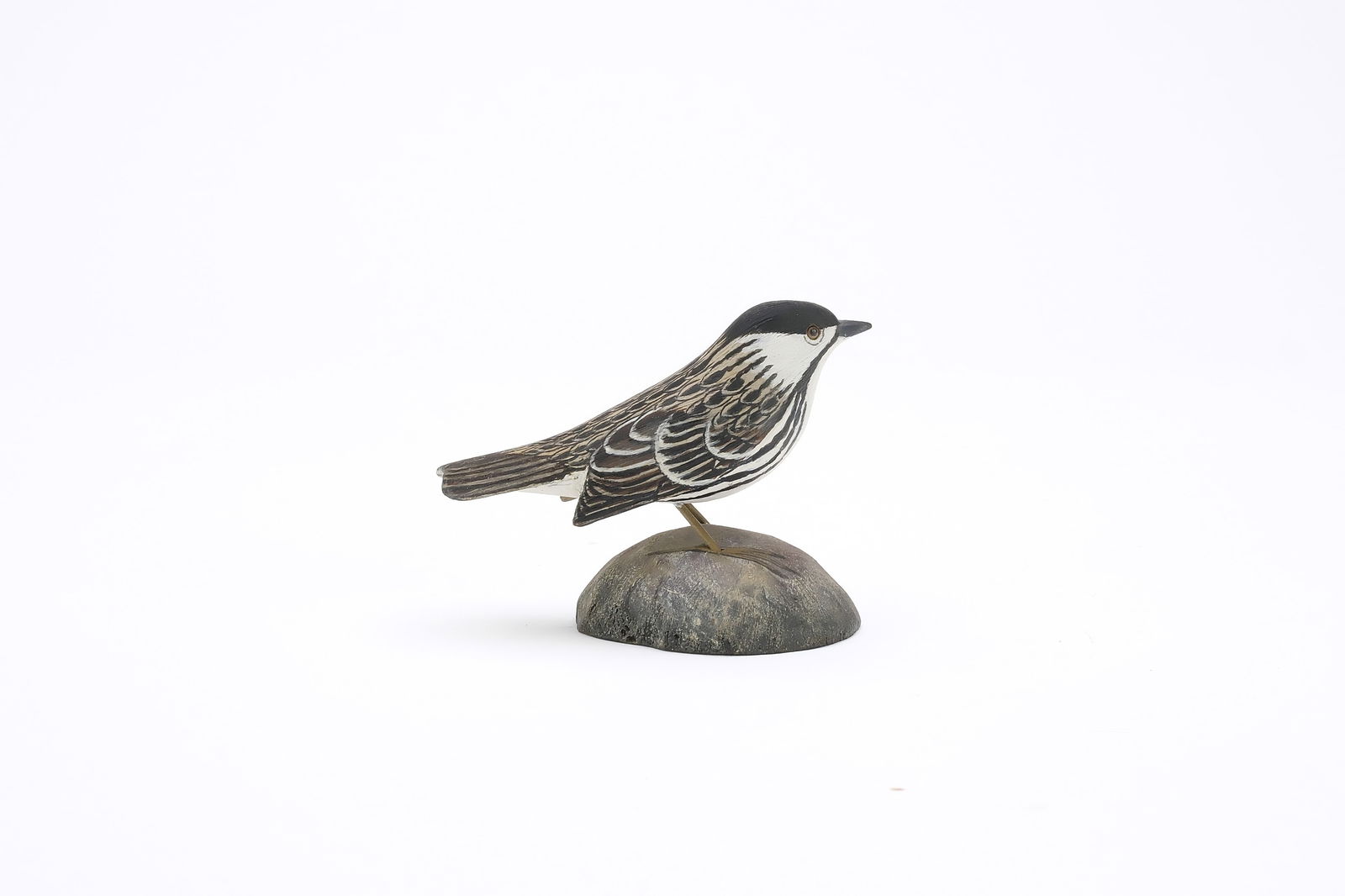 Jess Blackstone (1909-1988), Concord, New Hampshire.: Miniature blackpole warbler. Dropped wing carving and feather rasping. Identified, initialed, and numbered 3 on underside. Measures 3.5" long. Provenance: Joseph Ellis collection. Literature: "Bi