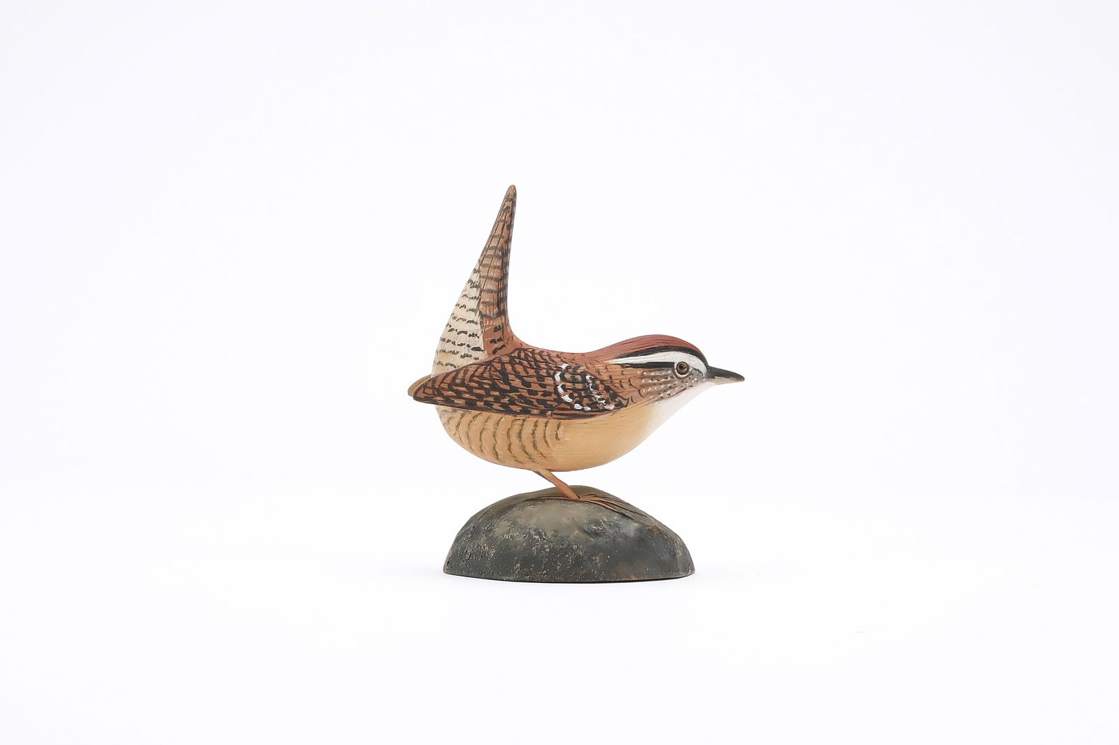 Jess Blackstone (1909-1988), Concord, New Hampshire.: Miniature Carolina wren. Dropped wing carving, feather rasping, and upswept tail. Identified, initialed, and numbered 5 on underside. Measures 3.25" long. Provenance: Joseph Ellis collection.