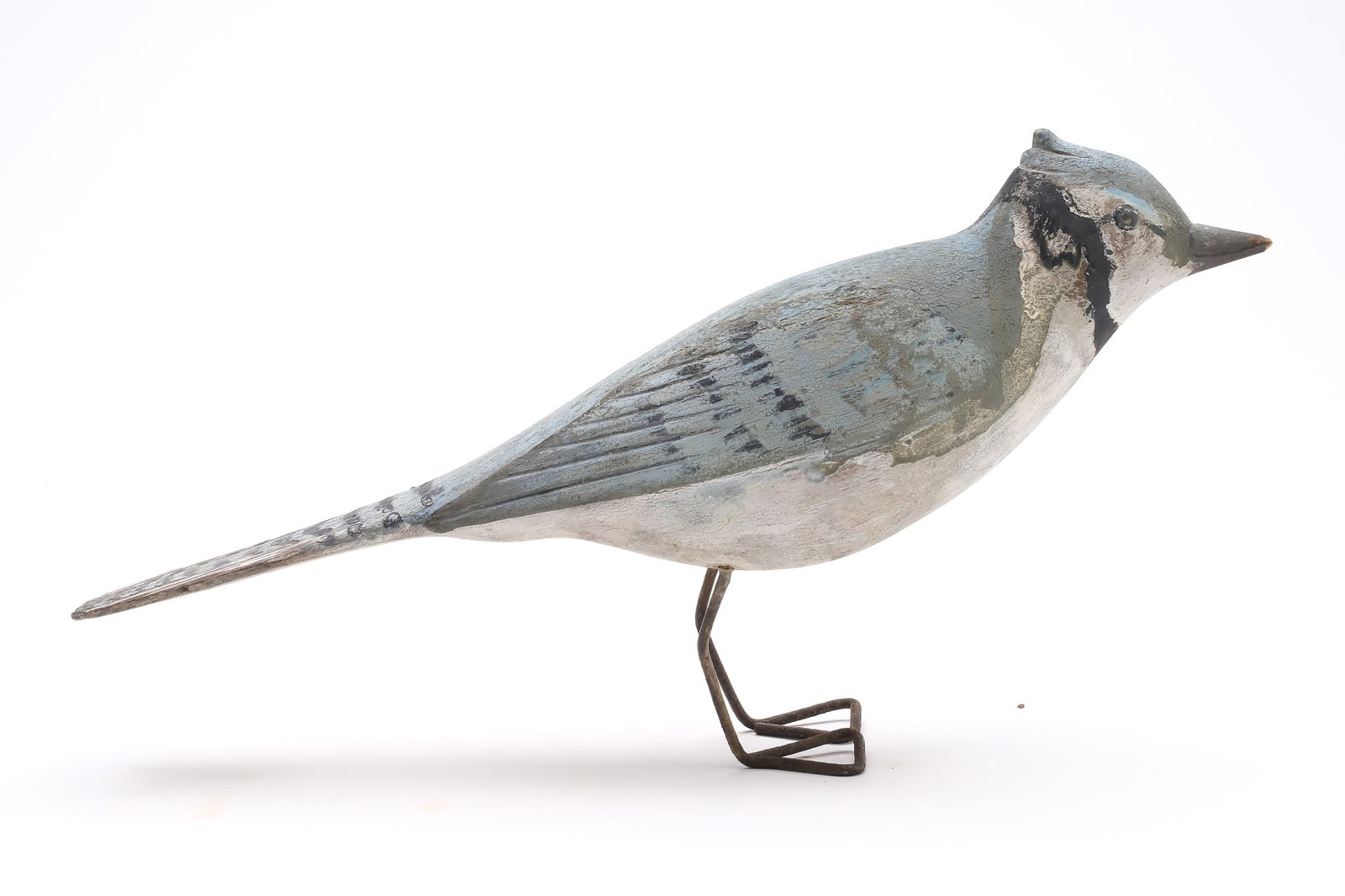Augustus "Gus" Wilson (1864-1950), South Portland, Maine.: Bluejay. Relief wing carving and extended wingtips. Incised feather detail. Measures 11.5" long.