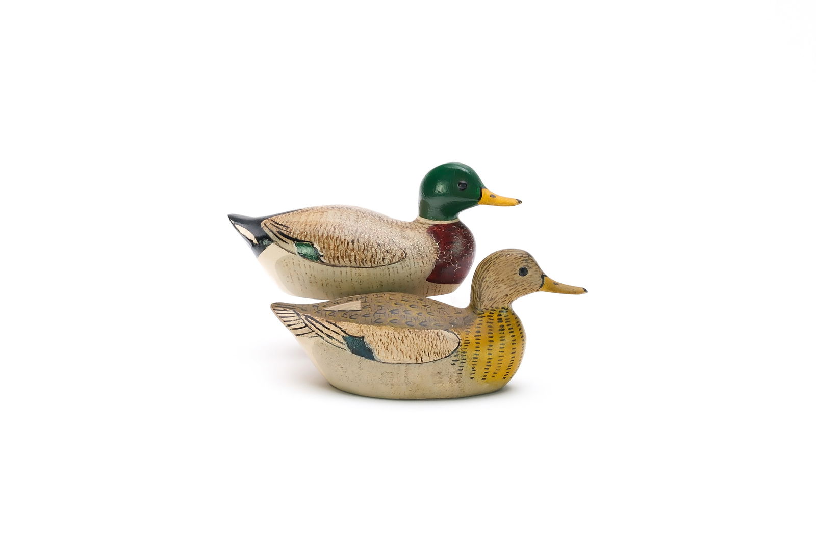 George Boyd (1873-1941), Seabrook, New Hampshire.: Pair of miniature mallards. Drake with slightly turned head. Measure 4.25" long. Provenance: Dan Graf collection.