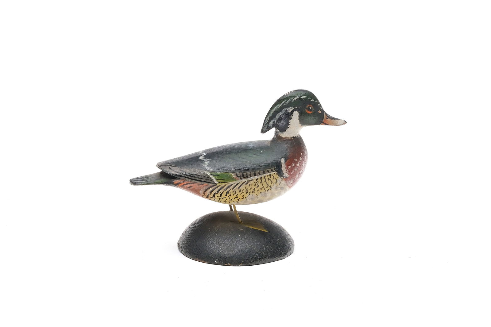 A. Elmer Crowell (1862-1952), East Harwich, Massachusetts.: Miniature woodduck. Extended crest carving. Maker's rectangle stamp and 23 on underside. Measures 4.25" long.